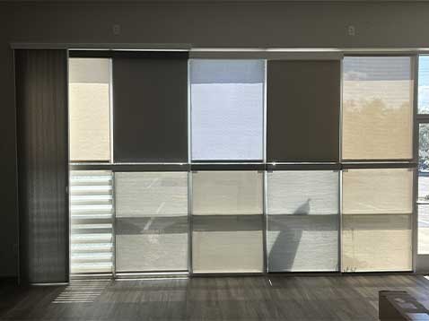Store interior showcasing several different types of window coverings