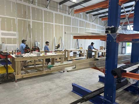 Men working with wood in a warehouse