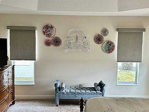 Eclectic bedroom with shaded windows